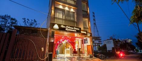 A multi-story building with a sign reading 'The Neeraj Ranga Ranimahal.'
