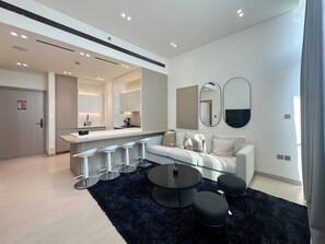 Luxury Apartment, 1 Queen Bed with Sofa bed, Balcony, City View | Living area | Toys - Binghatti Phantom (Dubai)