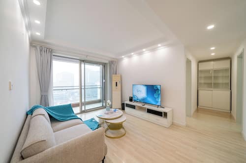City View 2BR Serviced Residence - Cozy Home for Families | Living room | 55-inch TV with cable channels