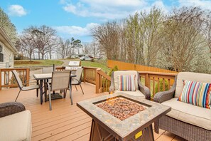 A deck with outdoor furniture, a fire pit, and a view of the surrounding landscape. - Long-range Mtn Views! Scenic Asheville Sanctuary (Asheville)