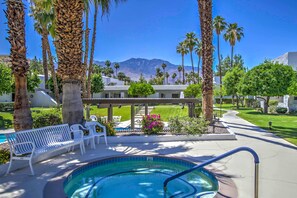A pool area with a hot tub, white lounge chairs, and palm trees. - 5 Mi to Dtwn! Extended-stay Palm Springs Condo (Palm Springs)