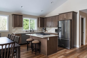 Fridge, microwave, oven, stovetop - May Creek Peaks: Custom built home on private acres w/ mountain views, covered spa, luxury amenities (Gold Bar)