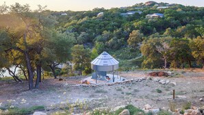 A gazebo on a hill with surrounding trees and a view of houses in the background. - Scenic Canyon Lake Container Retreat (Canyon Lake)