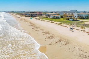 A beachside hotel with a pier, beachfront rooms, and a boardwalk. - The Shoreline Social - Front Row Beach Home, Cheers! (Surfside Beach)