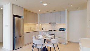 Fridge, microwave, oven, stovetop - Perfect 1 Bed l City Skyline Views l Coastal Haven (Emaar Beachfront)