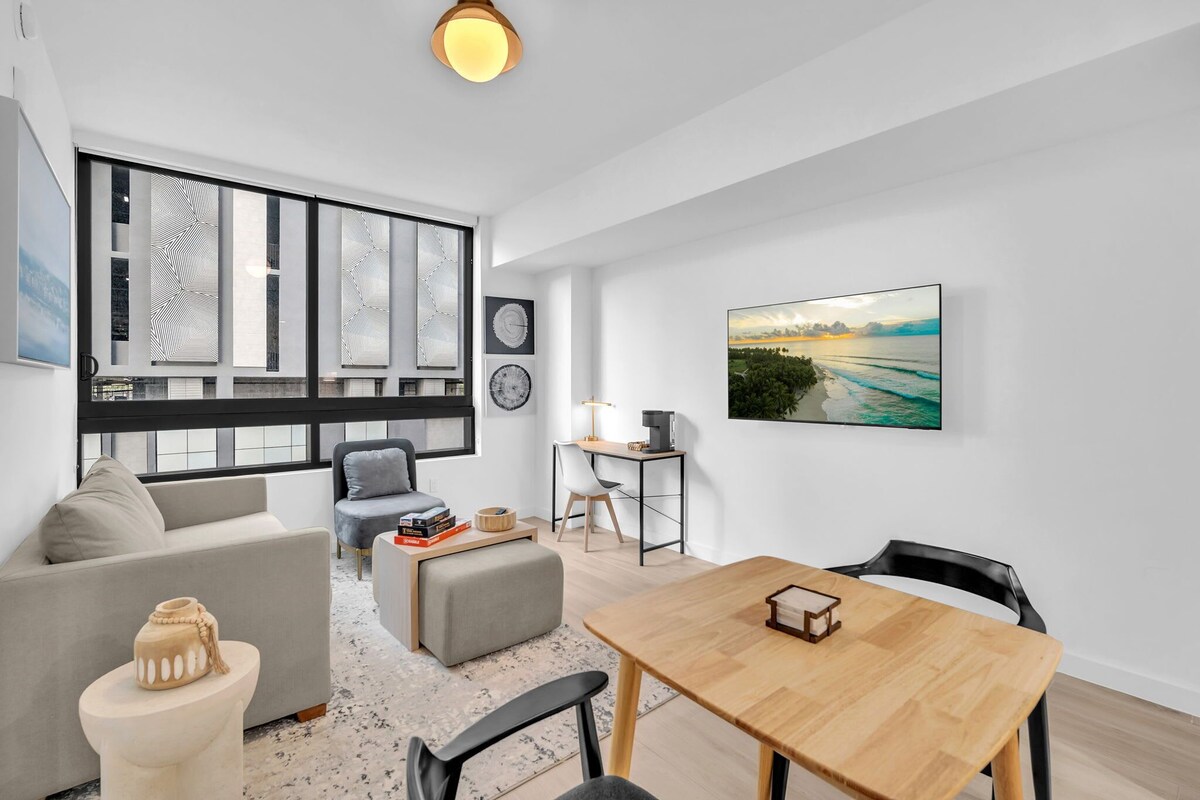 Deluxe Apartment | Living area | 50-inch Smart TV with cable channels
