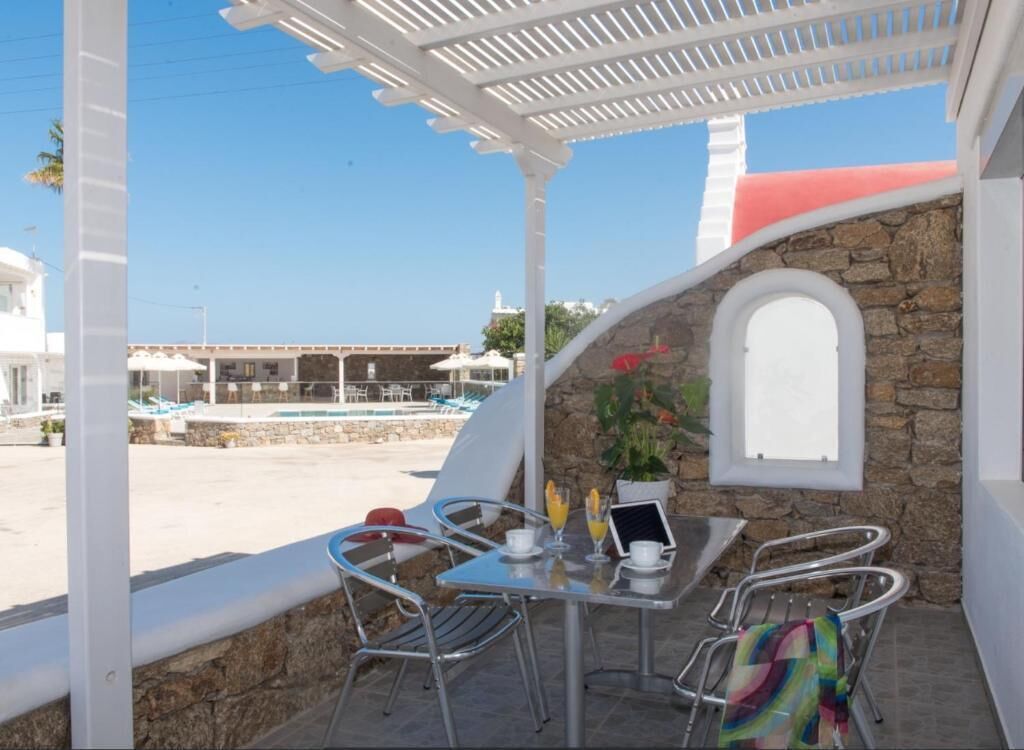 Standard Quadruple Room, Balcony, Garden View | Outdoor dining