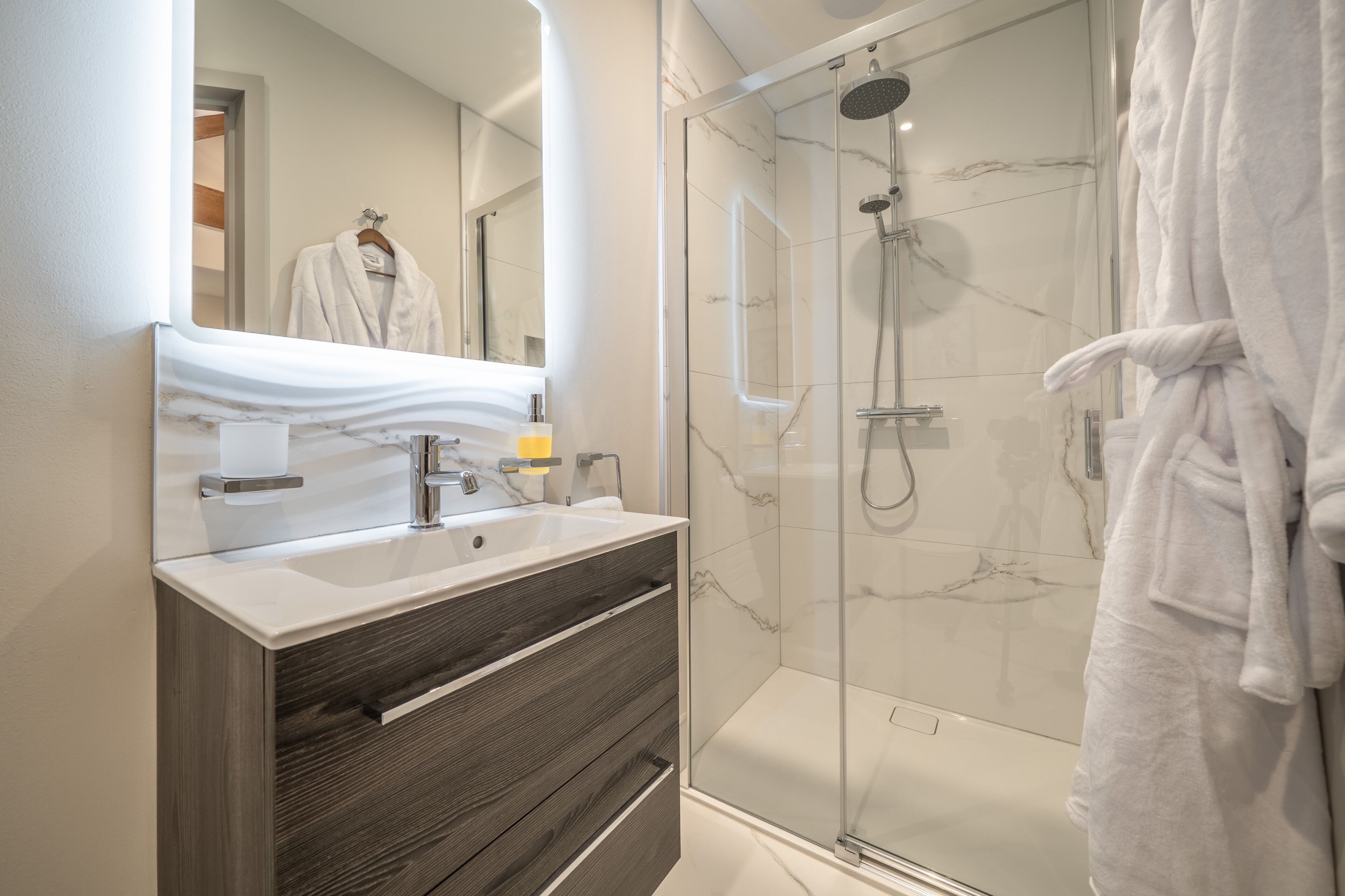 Shower, hair dryer, towels, soap
