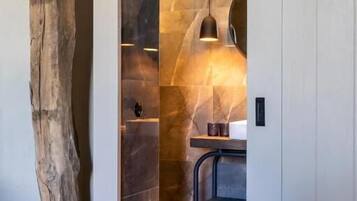 Deluxe Suite, Garden View | Bathroom | Shower, hair dryer, towels, soap