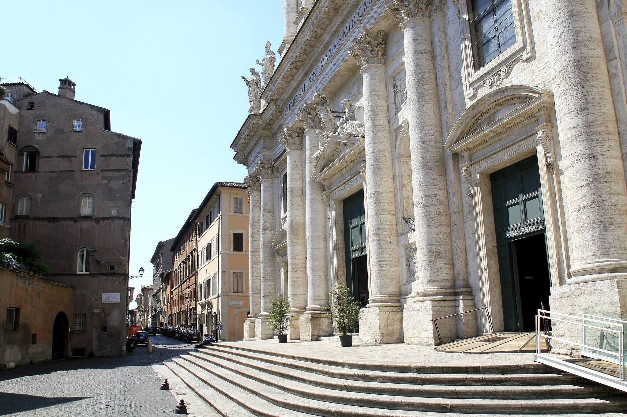 A historic building with classical architecture, including columns and detailed carvings.