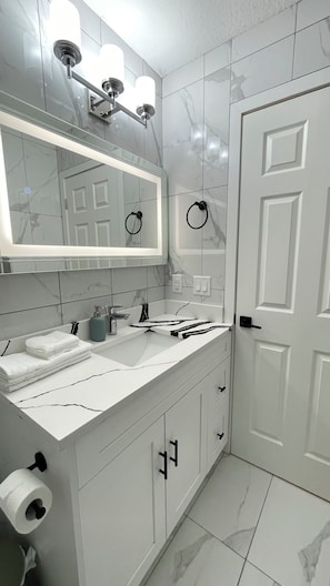 Hair dryer, towels, soap, toilet paper