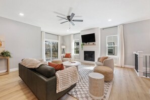 TV, fireplace, books - Family Home | Sleeps 8 | Walk to K-State (Manhattan)
