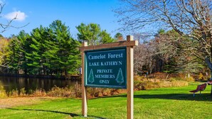 A sign for Camelot Forest Lake Kathryn, indicating it is a private members-only area. - Hot Tub*Sauna*Pool Table*Air Hockey*King Bed*Deck (Blakeslee)