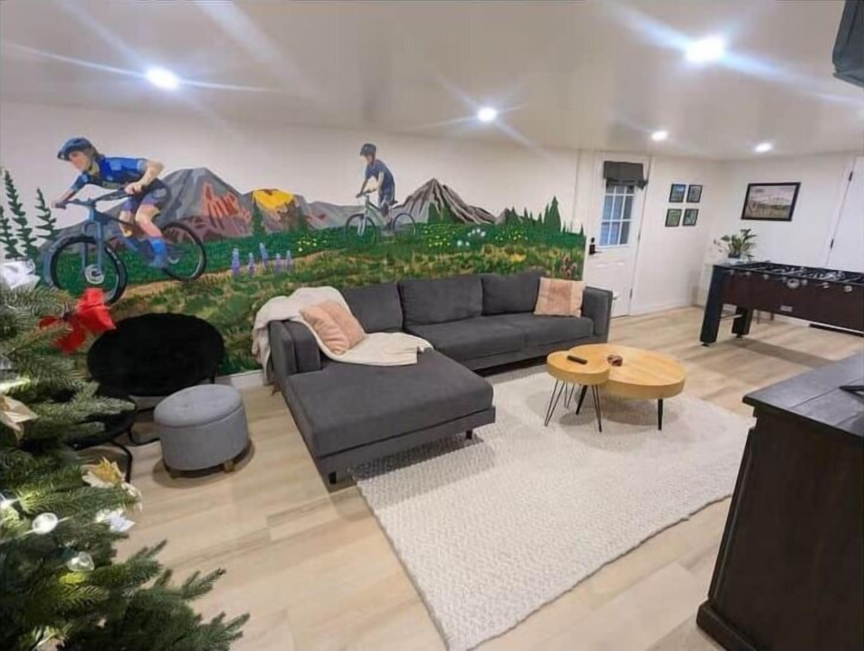 Parker's Den living room with custom mural