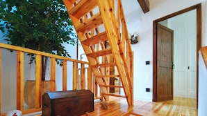 A wooden staircase with a view of a room. - House in La Cerdanya, Ger. Surrounded by nature (La Pleta de Saga)
