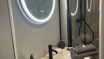 Shower, hair dryer, towels, soap