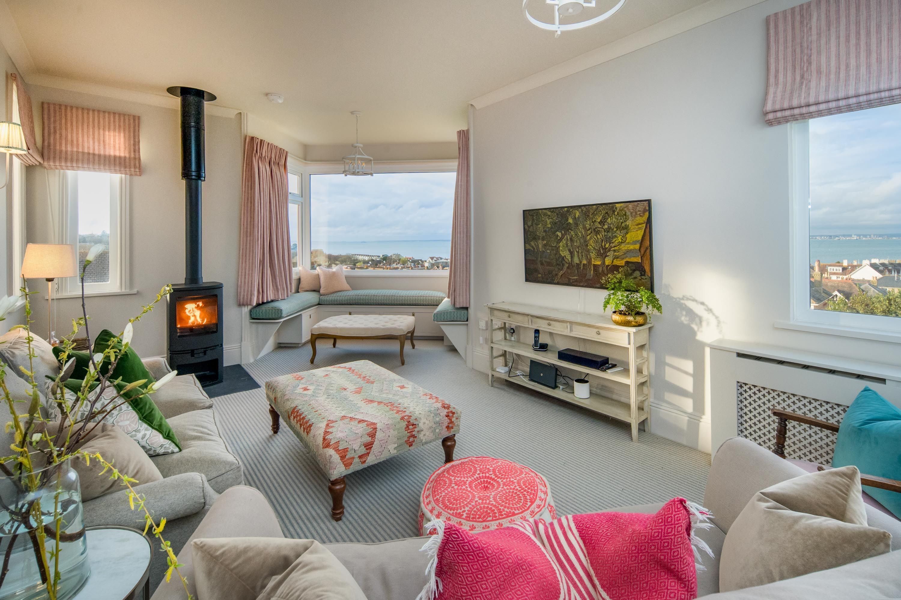 Smart TV, fireplace, books, computer monitors