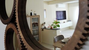 A room with a dining area, a kitchen, and a living space. - The Overlook Tangier - Panoramic Sea and Kasbah View Downtown (Tanger)