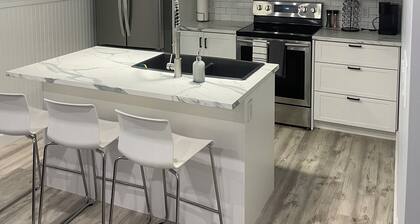 Cozy two-bedroom basement apartment equipped with a full kitchen! (Min 28 days)