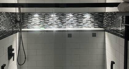 Cozy two-bedroom basement apartment equipped with a full kitchen! (Min 28 days)