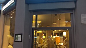 A restaurant named 'Fogo de Chão' with a glass entrance and visible interior seating. - 2-Bed 2-Bath Sea-View Balcony Apt inc Sun Terrace minutes to Sea, Station, Shops (Brighton and Hove)