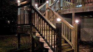 A wooden staircase leading to a deck with railings and lights. - Peaceful Hot Tub Hideaway - 15 mins to Chatt - Dog Friendly (Rossville)