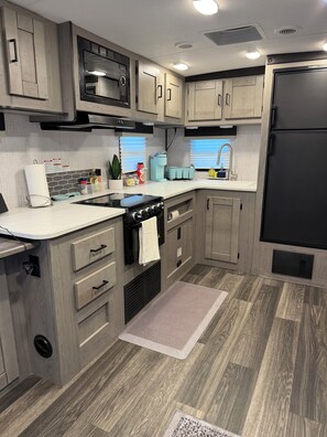 Fridge, microwave, oven, stovetop - Enjoy a cozy getaway in this modern 1-bedroom place. (Rosenberg)