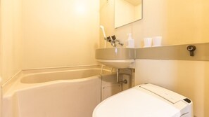 A bathroom with a bathtub, a sink, a toilet, and a mirror. - HOTEL nehako (Hakone)