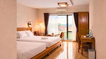 Deluxe Triple Room, Multiple Beds, Private Bathroom, Garden View | Minibar, desk, laptop workspace, rollaway beds