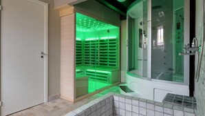 A modern bathroom with a glass-enclosed shower, a separate glass-enclosed sauna, and a tiled floor. - 20 Person Holiday Home in Skaerbaek (Skaerbaek)