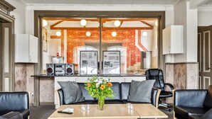 A modern living room with a sofa set, a coffee table, and a decorative vase. - 20 Person Holiday Home in Skaerbaek (Skaerbaek)