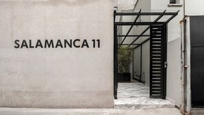 A building entrance with the sign 'SALAMANCA 11' and a metal gate. - Casa Monroy en Roma Norte - LowF (Ciudad de México)