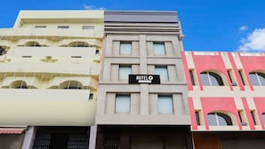 A hotel with a sign reading 'HOTELO' and a modern architectural design. - Deluxehotel Riash (Prayagraj)