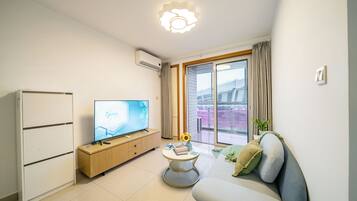 City View 1BR Serviced Residence - Spacious Living Room & Kitchen | Living room