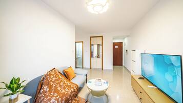 Familie suite, 1 queensize bed, niet-roken, uitzicht op stad | Woonruimte