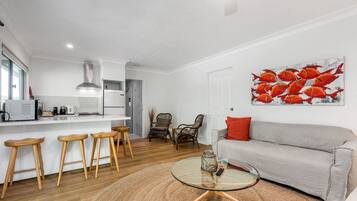 Quarto casal luxo, vista para a colina | Área de estar