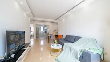 City View 2BR Serviced Residence - Cozy Home for Families | Living area | 55-inch TV with cable channels