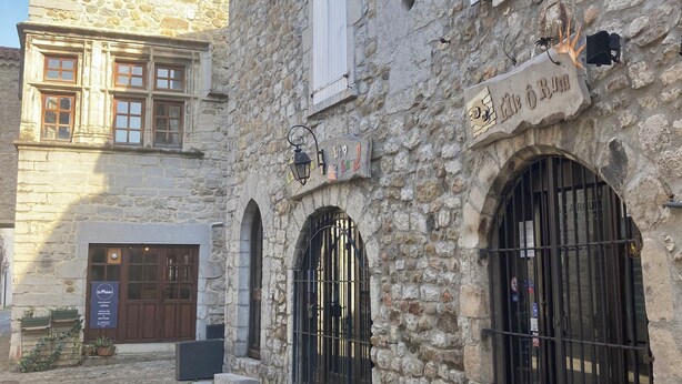 A stone building with a sign reading 'le OBRUM.' - "L'Olivier" air-conditioned house / 700 m2 (Ruoms)