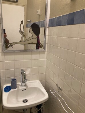 A bathroom with a sink, mirror, and tiled walls. - "L'Olivier"—air-conditioned house / 700 m² (Ruoms)