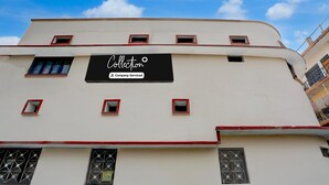 A building with a sign reading 'Collection' and 'Company-Serviced.' - Deluxe Heritage Hotel (Prayagraj)
