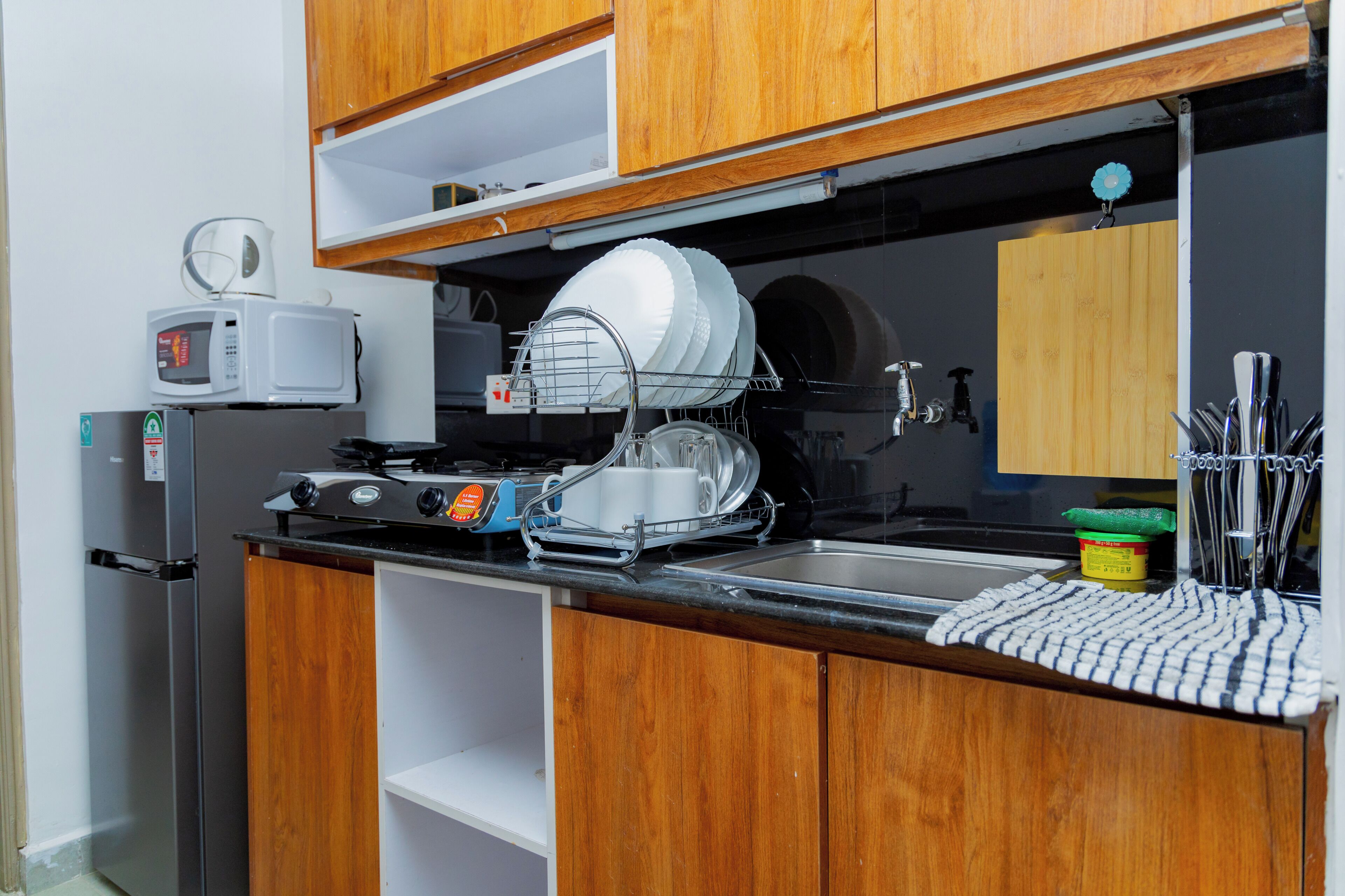 Fridge, microwave, stovetop, coffee/tea maker