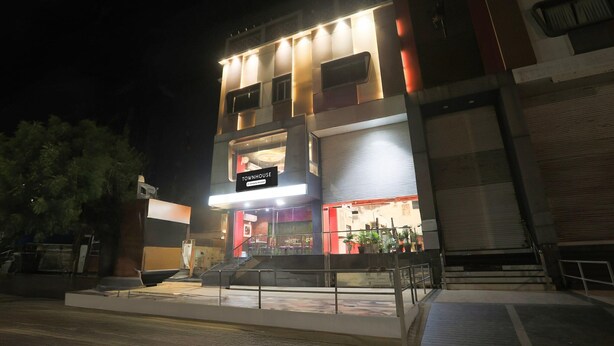 A multi-story building with a sign reading 'Townhouse.' - Townhouse Kota Airport (Kota)