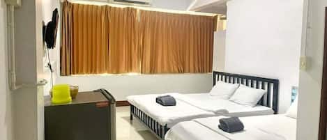 Triple Room, City View | Free minibar items, blackout drapes, free WiFi