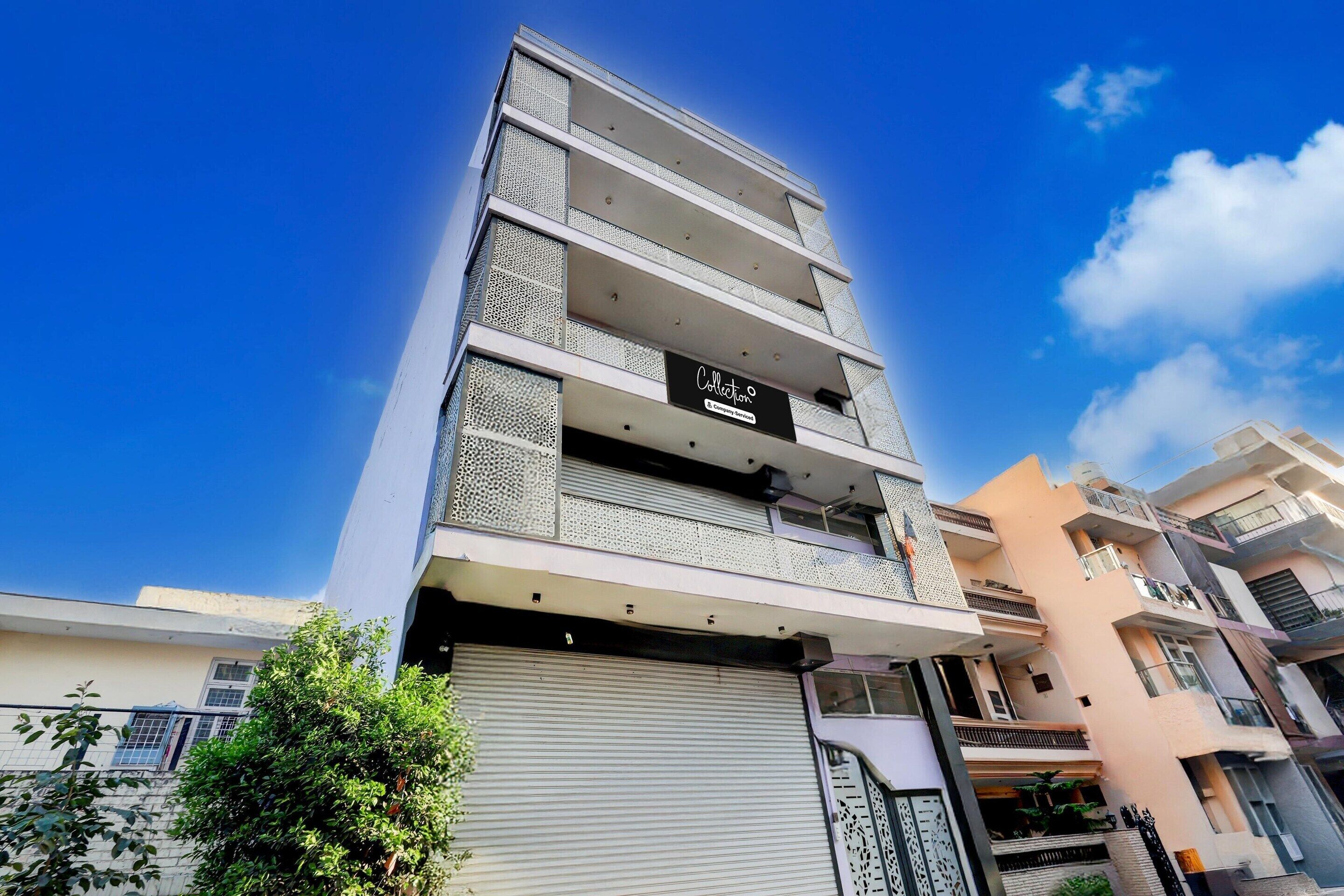 A multi-story building with a sign reading 'Collection.'