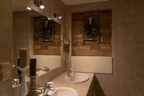 A bathroom with two sinks, a mirror, and wooden wall panels. - 10-guest Holiday Villa With Private Pool (Szemud)