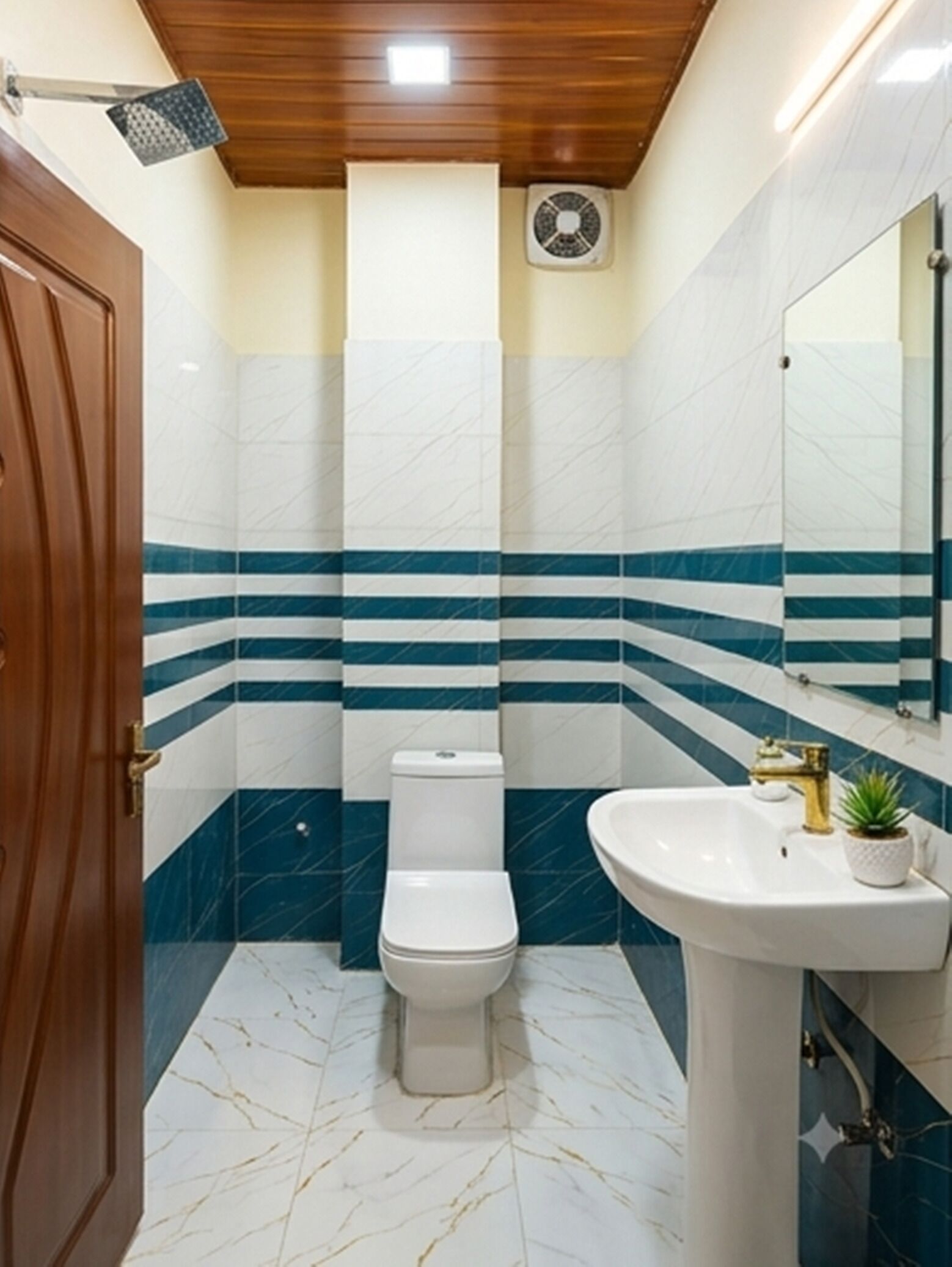 A bathroom with a toilet, sink, and a mirror.
