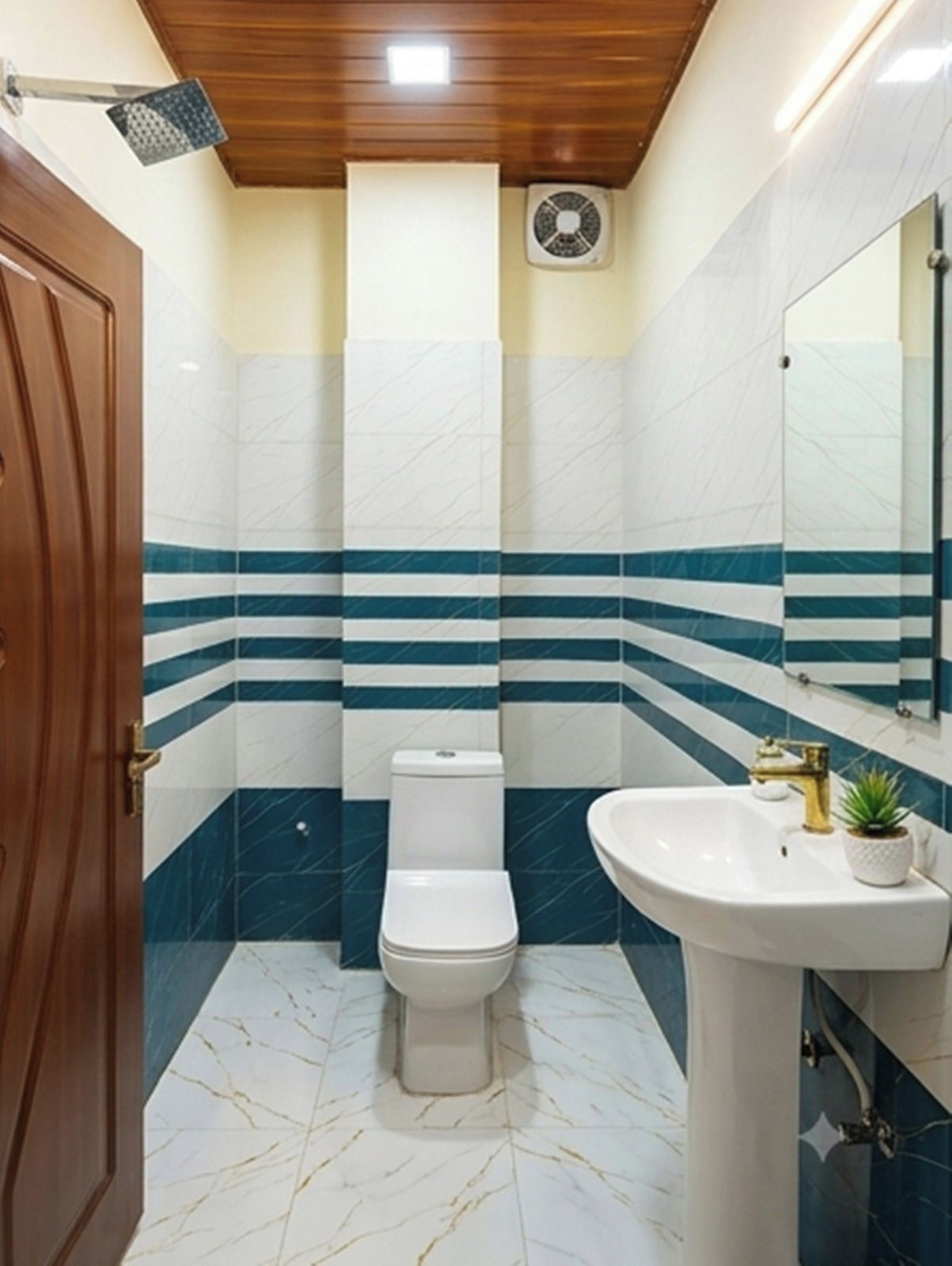 Un baño con inodoro, lavabo, espejo y ventilador de techo.