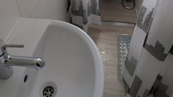 Shower, towels, soap, toilet paper