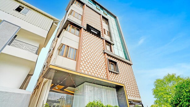 A modern building with a prominent 'Townhouse' sign, large windows, and a geometric facade. - Classic With Twin Bedindiranagar (Bengaluru)