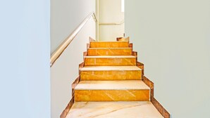 A staircase with marble steps leading upwards. - Deluxe spl Palace (Chennai)